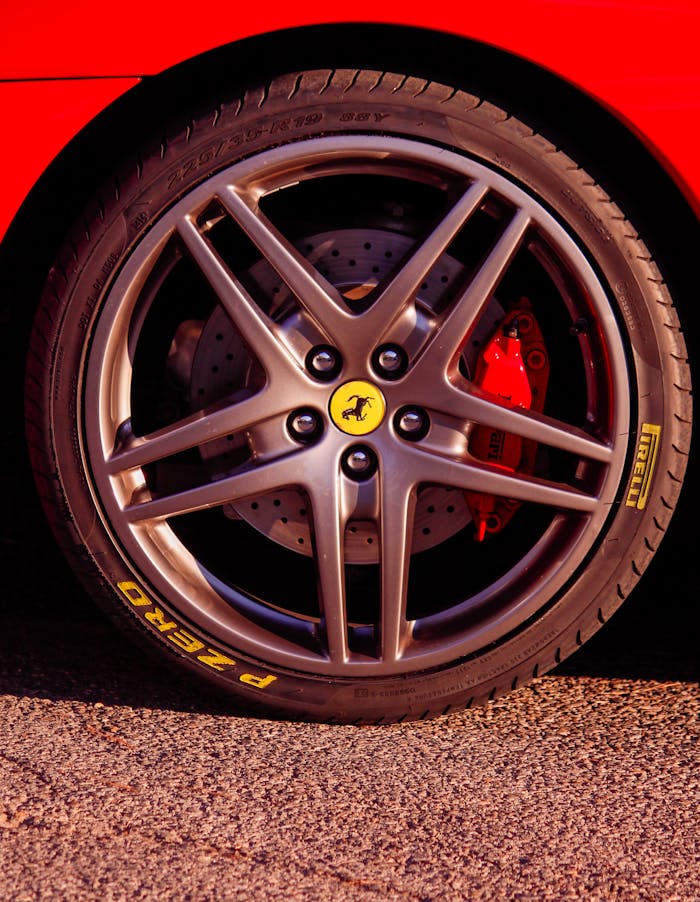 Detailed view of a sports car wheel with high-performance tire and brake disc.